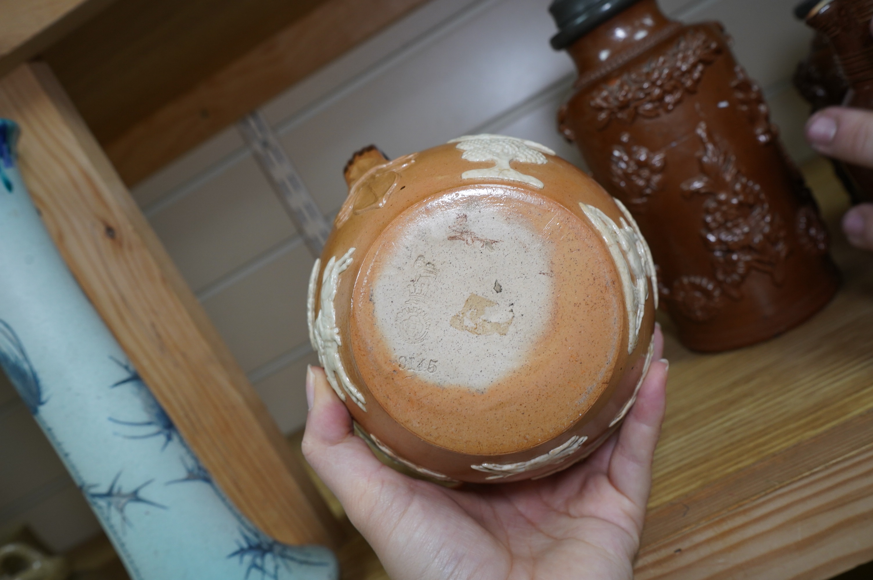 Four 19th century Derbyshire lead glazed stoneware jars and a stoneware jug and another, tallest 21cm (6). Condition - poor to fair